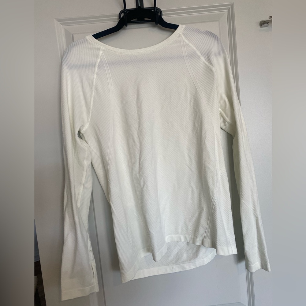 White athletic long sleeve top